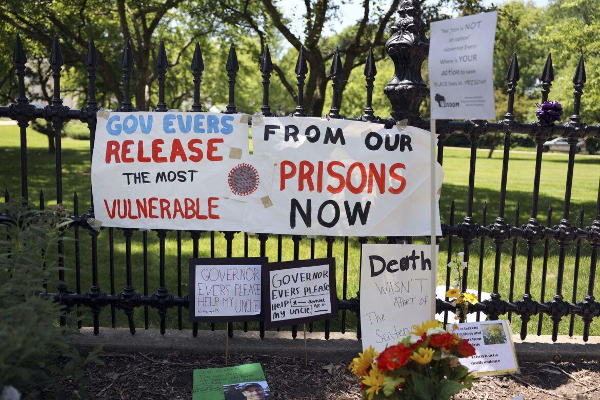 Signs on fence